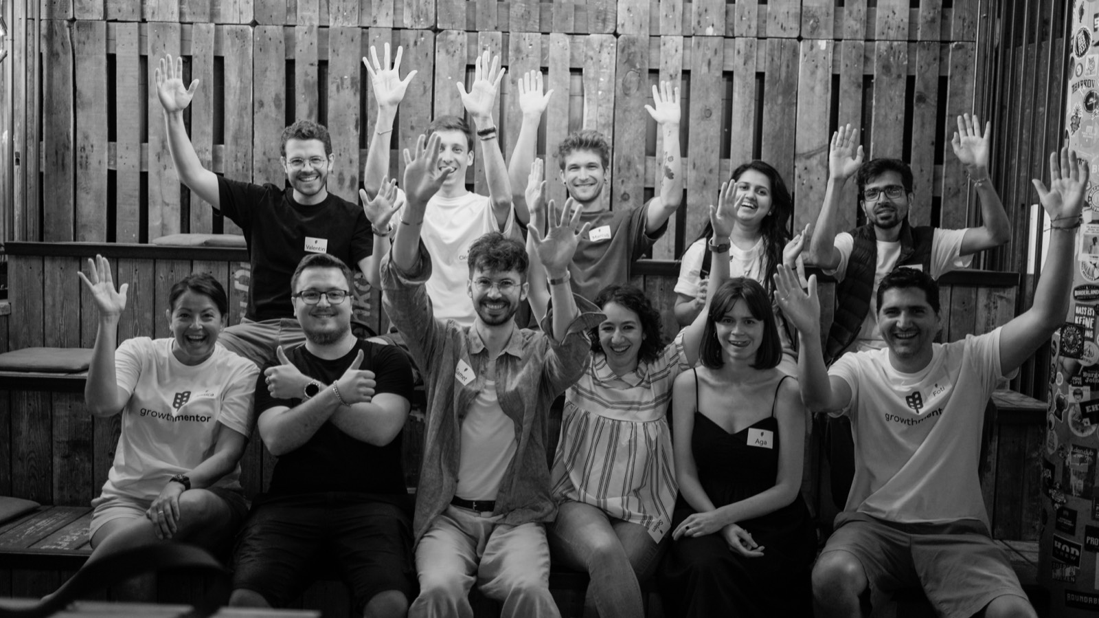 Founders with hands raised at a GrowthMentor meetup