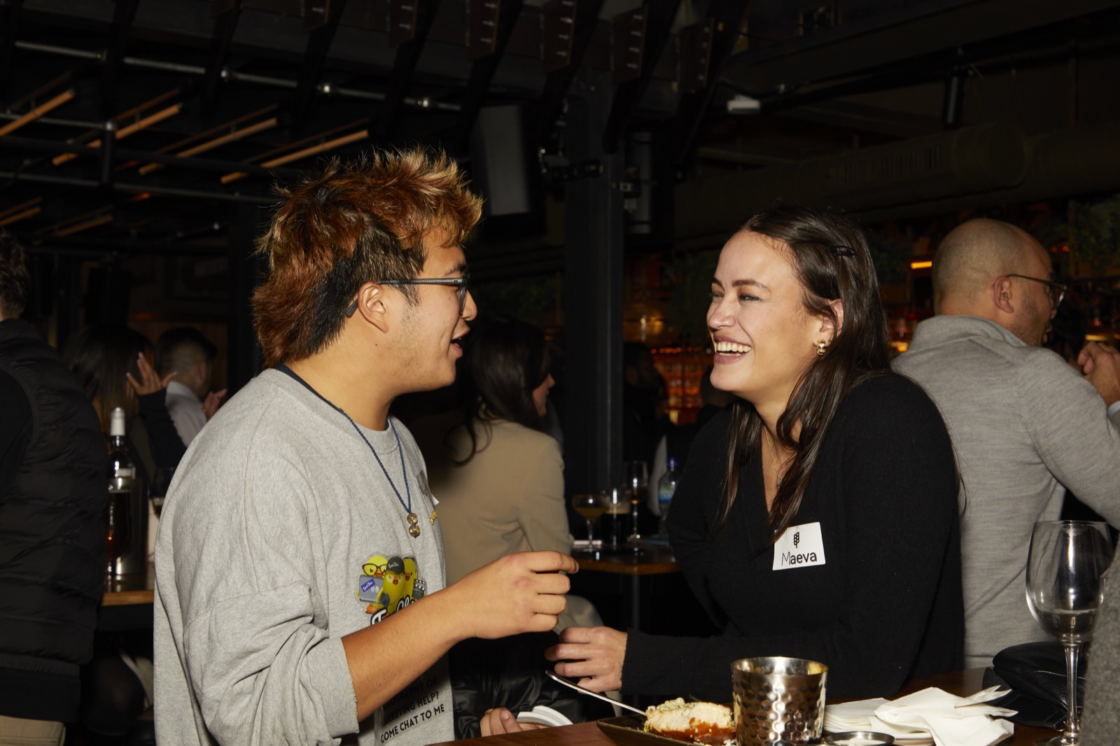 Two founders deep in conversation at a GrowthMentor meetup
