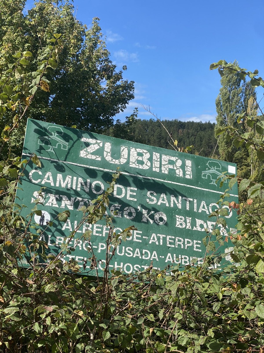 A weathered Zubiri Camino de Santiago road sign