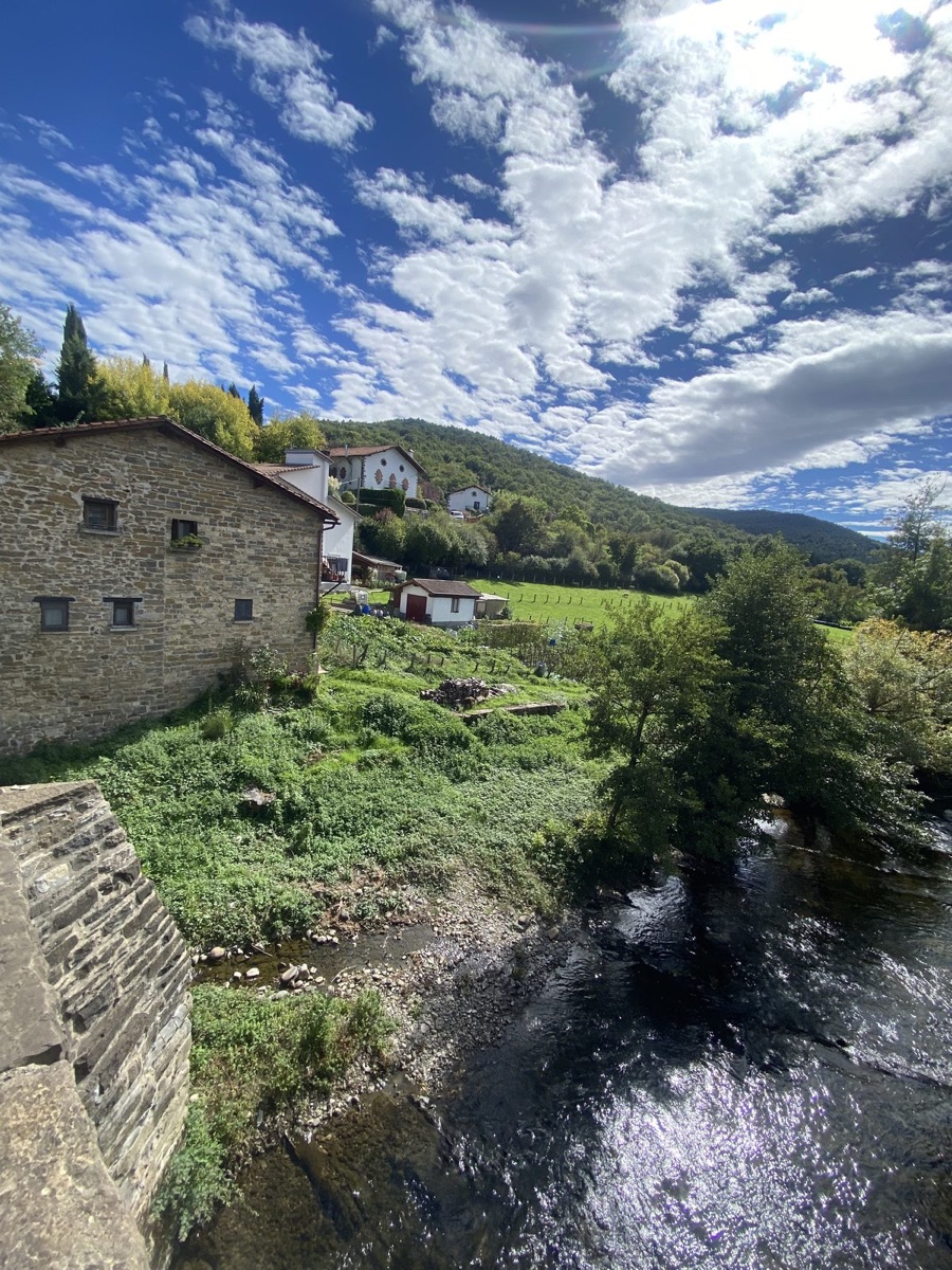 A stone bridge and houses in Zubiri